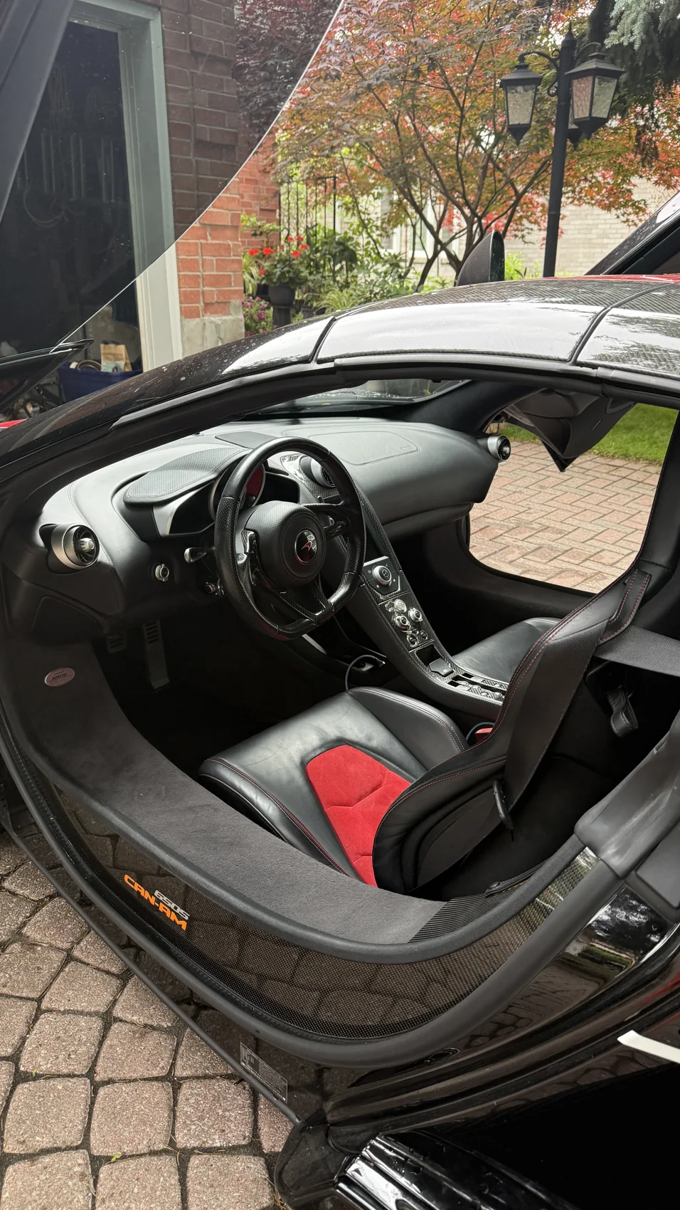 Detailed McLaren cabin with sports seats and steering wheel