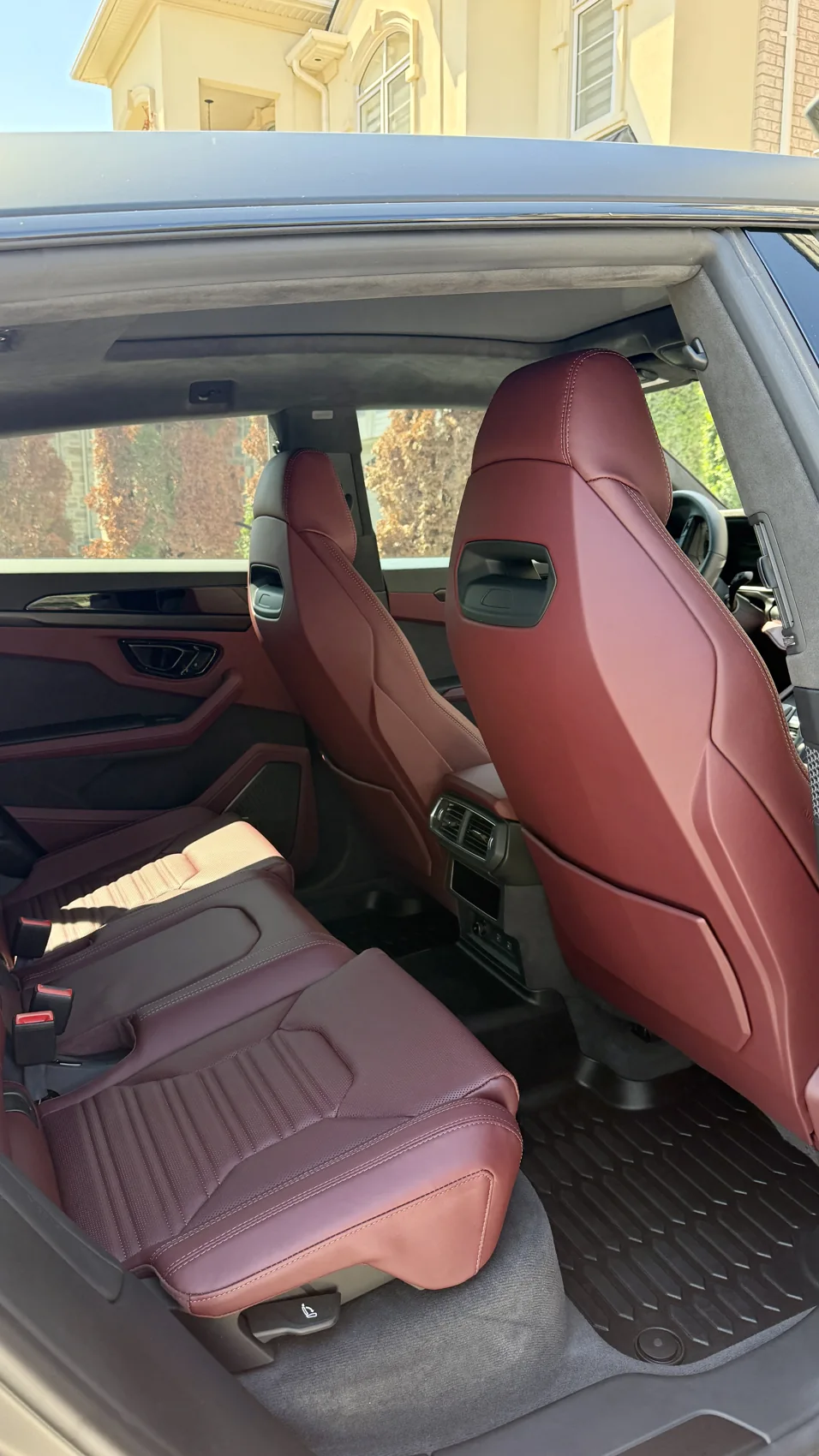 Detailed red leather rear seats in a Lamborghini Urus