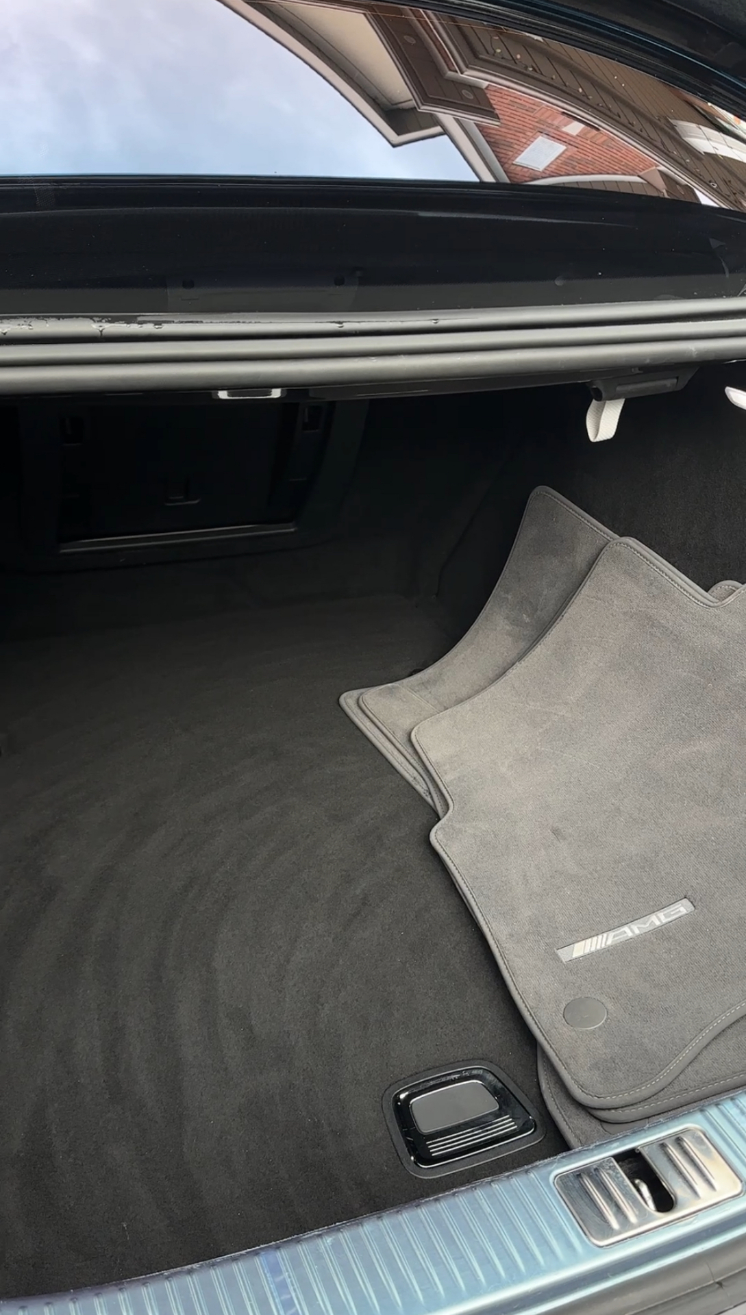 AMG trunk vacuumed with mats laid out